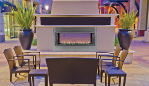 Electric fireplace installed in an outdoor patio.