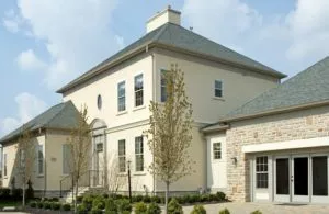 Building products installed on a large white stucco home in San Antonio.