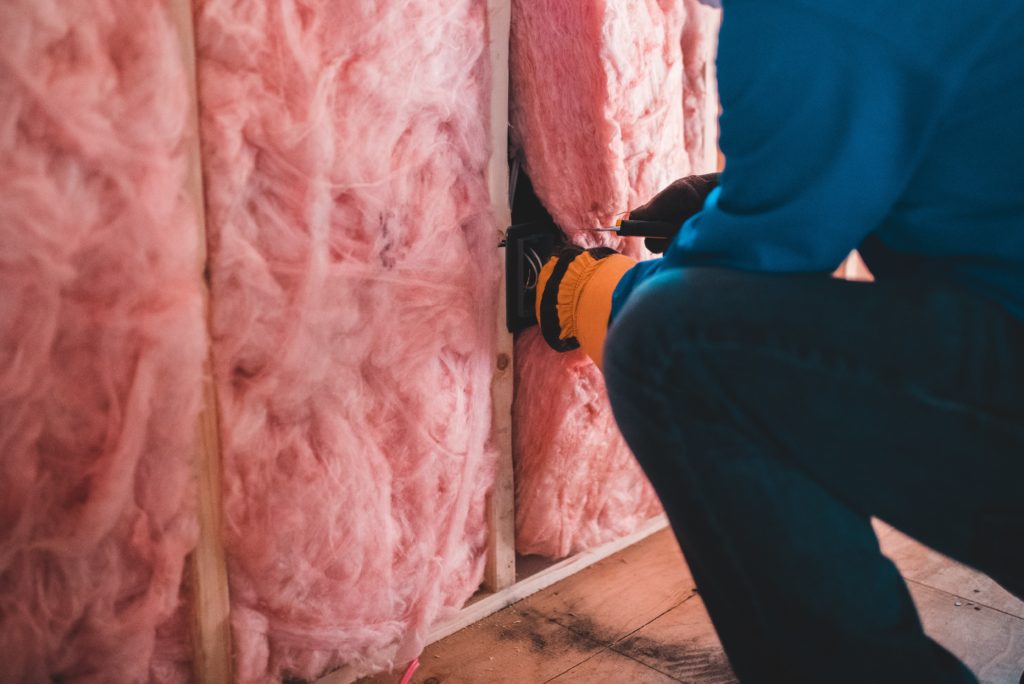 IBP Technician Installing Wall Insulation