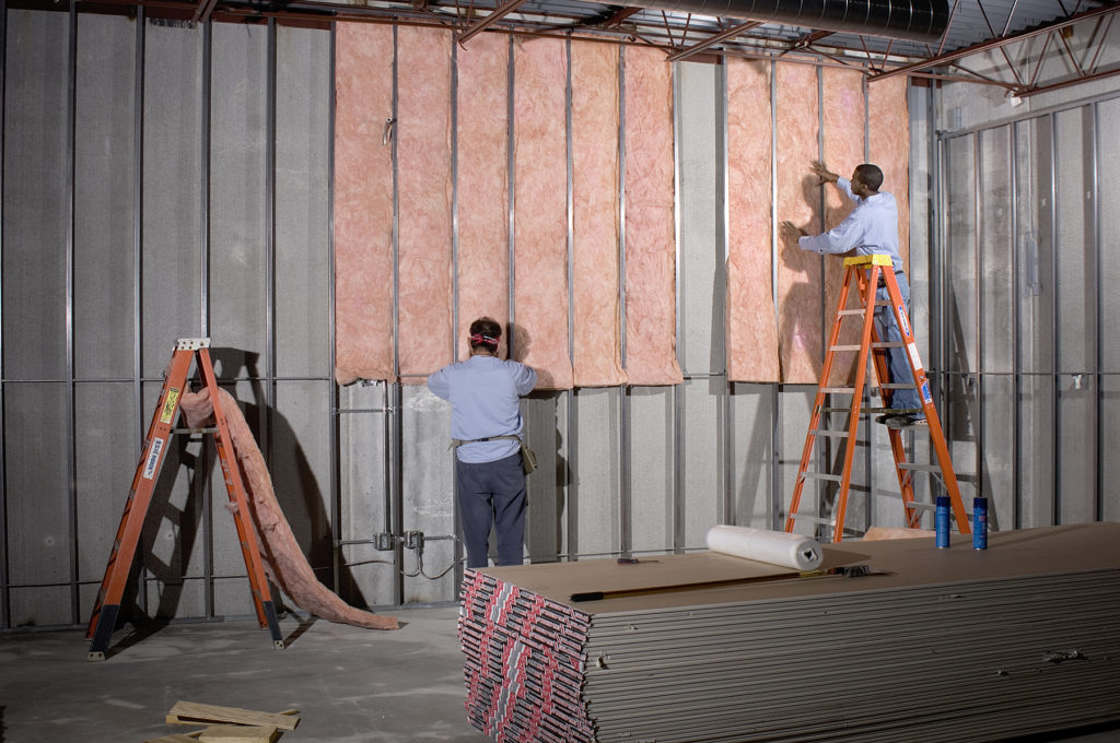 IBP Technicians Installing Insulation In a Commercial Building